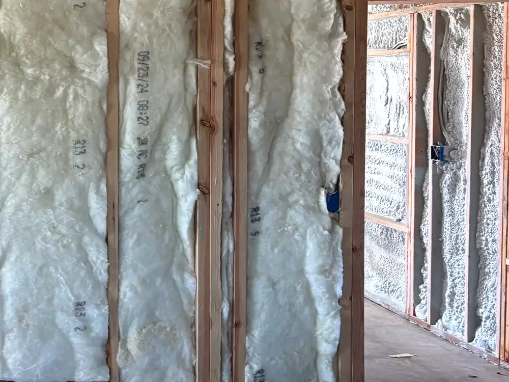 Spray foam insulation installation in a building under construction